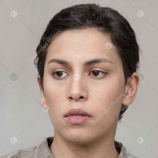 Neutral white young-adult female with short  brown hair and brown eyes