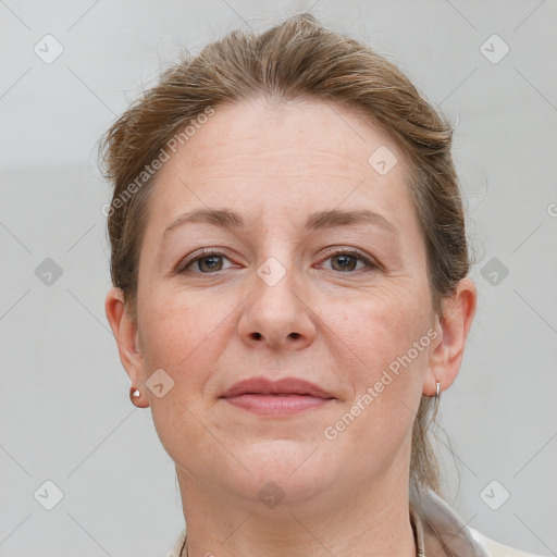 Joyful white adult female with short  brown hair and grey eyes