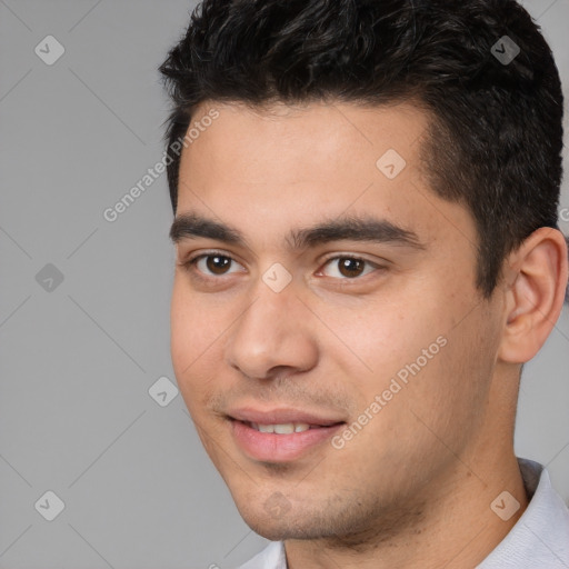 Joyful white young-adult male with short  black hair and brown eyes