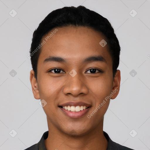 Joyful latino young-adult male with short  black hair and brown eyes