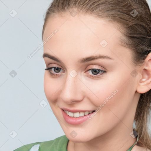 Joyful white young-adult female with medium  brown hair and blue eyes