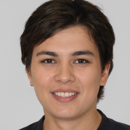 Joyful white young-adult male with medium  brown hair and brown eyes