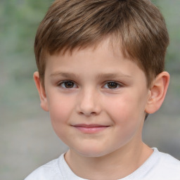 Joyful white child male with short  brown hair and brown eyes