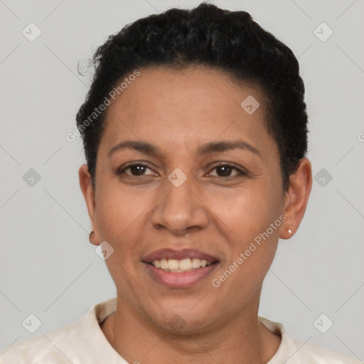 Joyful latino adult female with short  brown hair and brown eyes