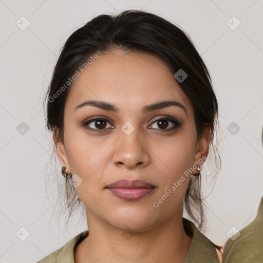 Joyful latino young-adult female with medium  brown hair and brown eyes