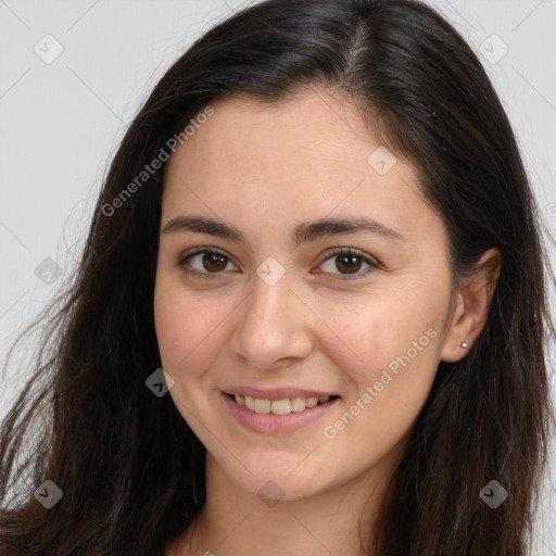 Joyful white young-adult female with long  brown hair and brown eyes