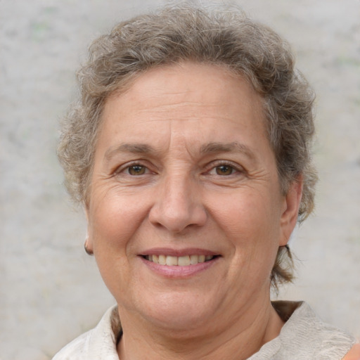 Joyful white middle-aged female with short  brown hair and brown eyes