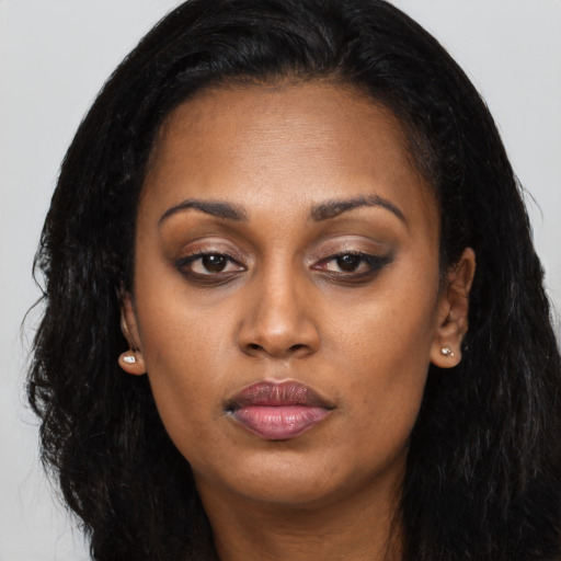 Neutral latino young-adult female with long  black hair and brown eyes