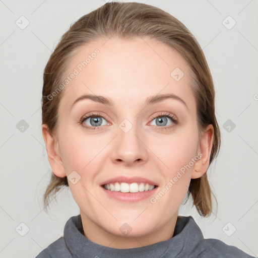 Joyful white young-adult female with medium  brown hair and blue eyes