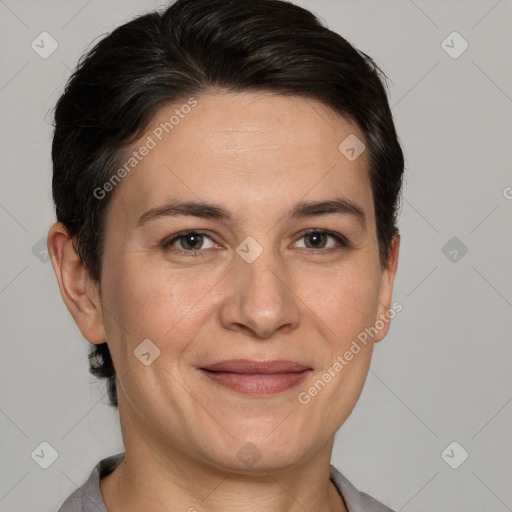 Joyful white adult female with short  brown hair and grey eyes