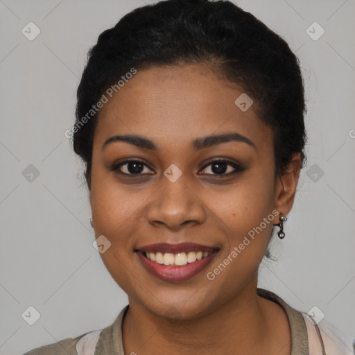 Joyful latino young-adult female with short  brown hair and brown eyes