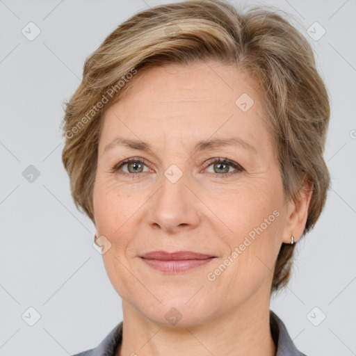 Joyful white adult female with short  brown hair and grey eyes