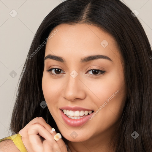 Joyful white young-adult female with long  brown hair and brown eyes