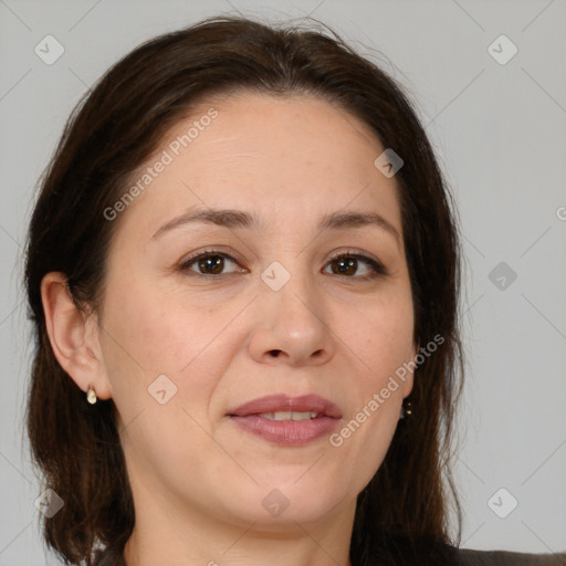 Joyful white adult female with medium  brown hair and brown eyes