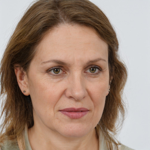 Joyful white adult female with medium  brown hair and brown eyes