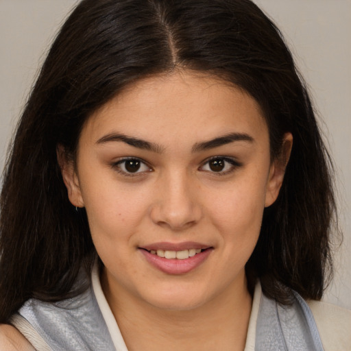 Joyful white young-adult female with medium  brown hair and brown eyes