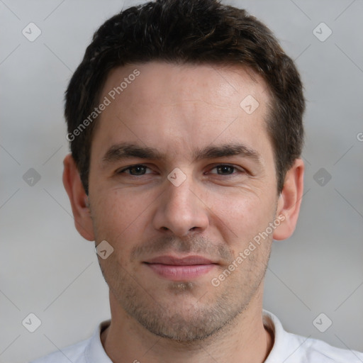 Joyful white young-adult male with short  brown hair and brown eyes