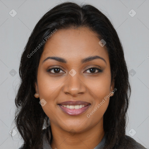 Joyful black young-adult female with long  brown hair and brown eyes