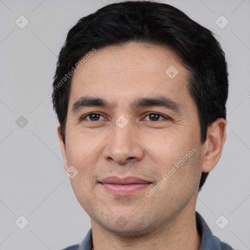 Joyful white young-adult male with short  black hair and brown eyes