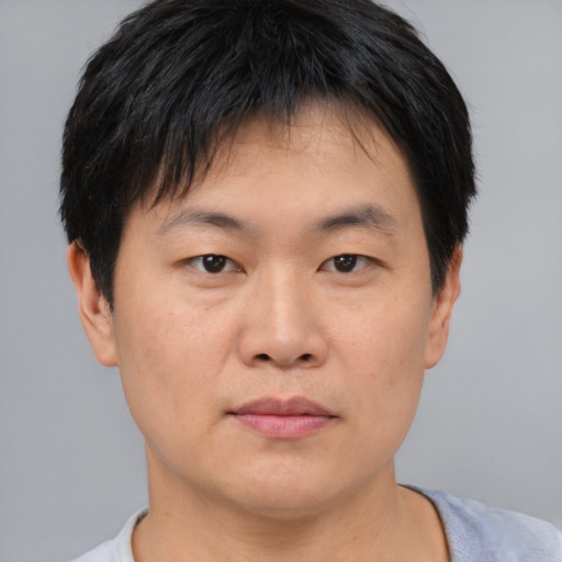 Neutral asian young-adult male with short  black hair and brown eyes