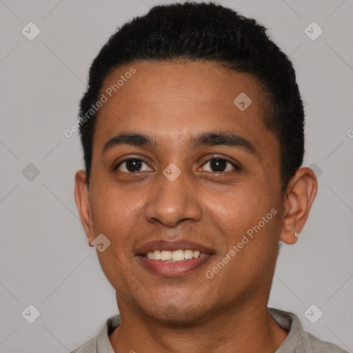 Joyful latino young-adult male with short  black hair and brown eyes