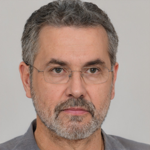 Neutral white middle-aged male with short  gray hair and brown eyes