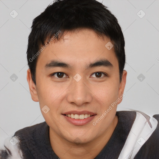 Joyful asian young-adult male with short  black hair and brown eyes