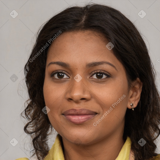 Joyful black young-adult female with medium  brown hair and brown eyes