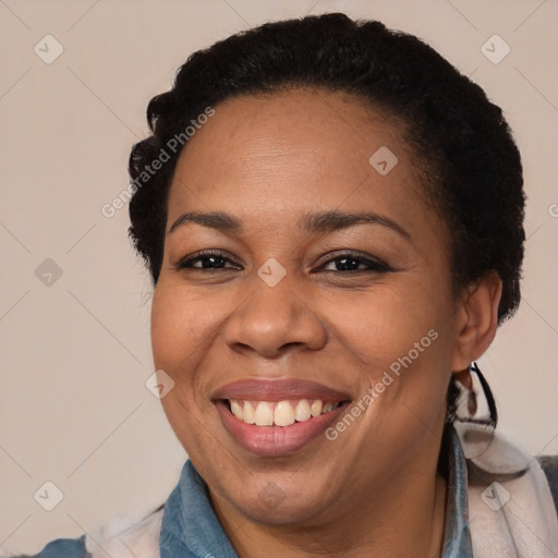 Joyful black adult female with short  brown hair and brown eyes