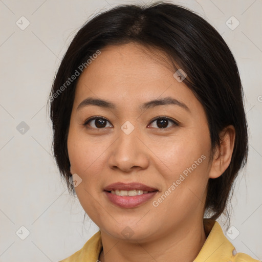 Joyful latino young-adult female with medium  brown hair and brown eyes