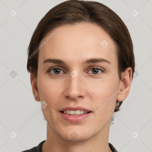 Joyful white young-adult female with short  brown hair and grey eyes