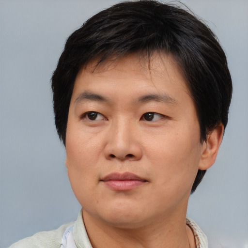 Neutral asian young-adult male with short  brown hair and brown eyes