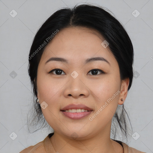 Joyful asian young-adult female with medium  black hair and brown eyes