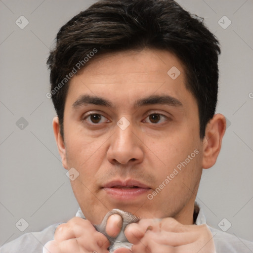 Neutral white young-adult male with short  brown hair and brown eyes