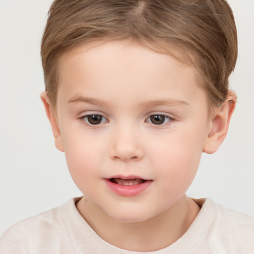 Joyful white child female with short  brown hair and brown eyes