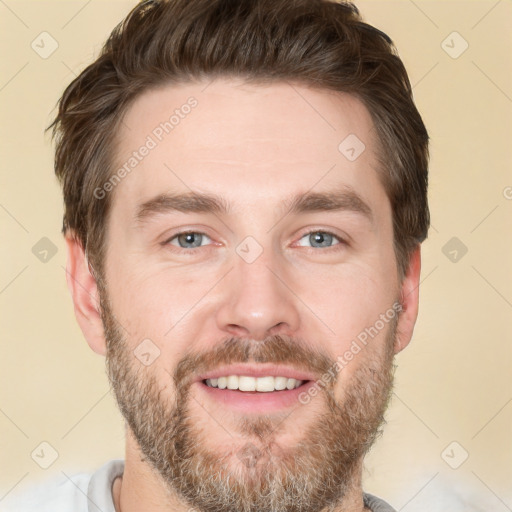 Joyful white adult male with short  brown hair and brown eyes