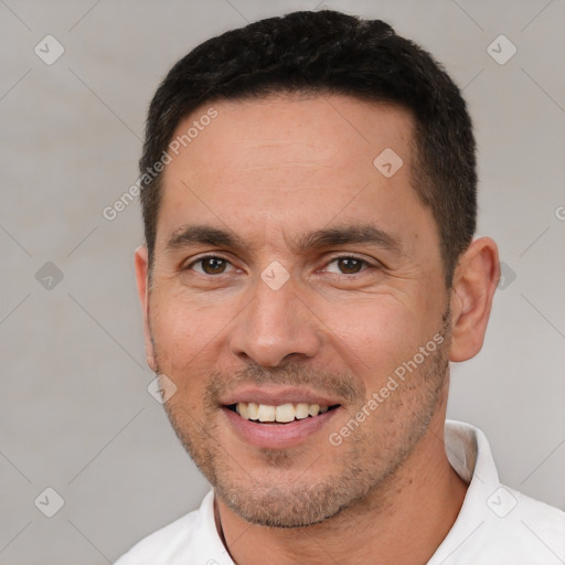 Joyful white young-adult male with short  brown hair and brown eyes