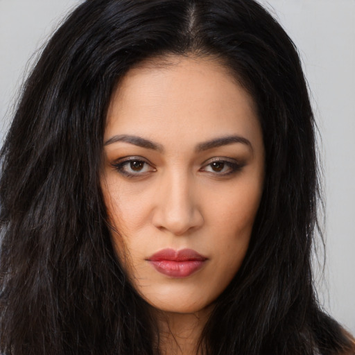 Neutral latino young-adult female with long  brown hair and brown eyes