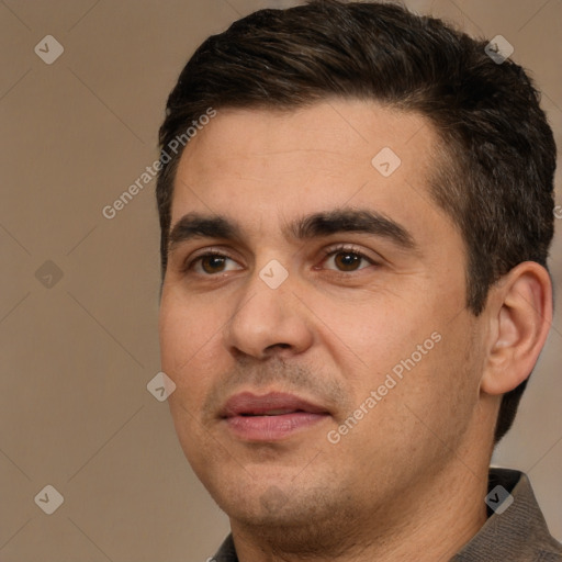 Joyful white young-adult male with short  brown hair and brown eyes