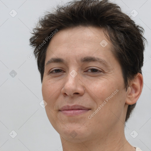 Joyful white adult female with short  brown hair and brown eyes