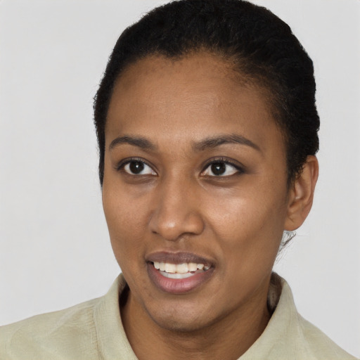 Joyful latino young-adult female with short  black hair and brown eyes