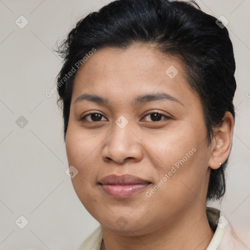 Joyful latino young-adult female with medium  brown hair and brown eyes