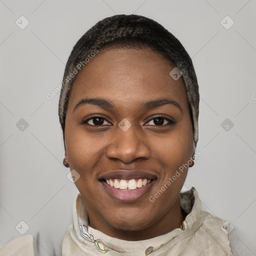 Joyful black young-adult female with short  black hair and brown eyes