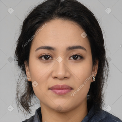 Joyful latino young-adult female with medium  brown hair and brown eyes