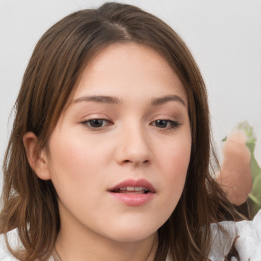 Neutral white young-adult female with medium  brown hair and brown eyes