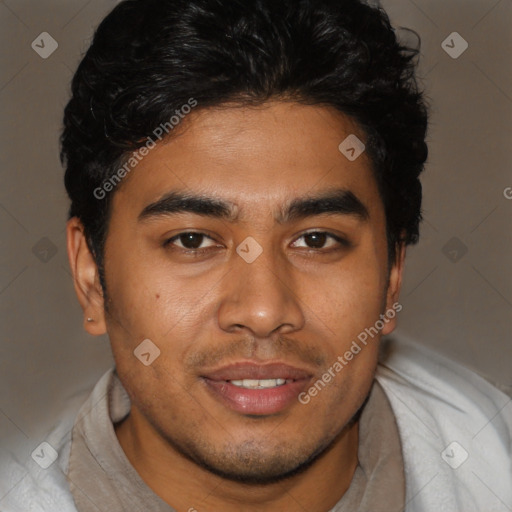 Joyful latino young-adult male with short  brown hair and brown eyes