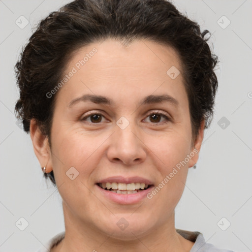 Joyful white adult female with short  brown hair and brown eyes