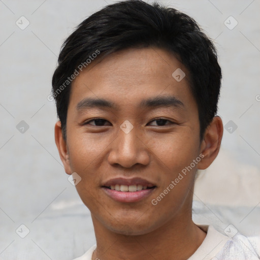 Joyful asian young-adult male with short  black hair and brown eyes