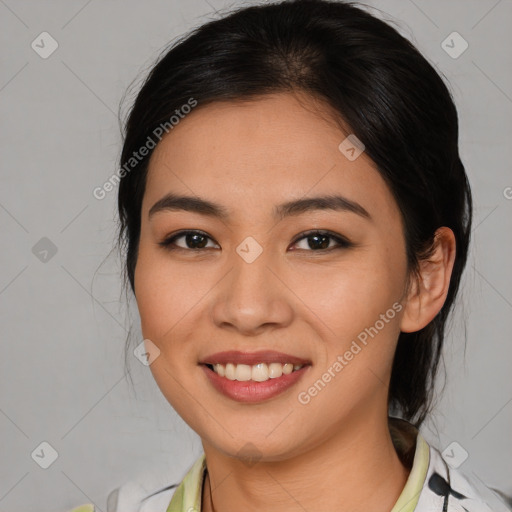 Joyful latino young-adult female with medium  brown hair and brown eyes