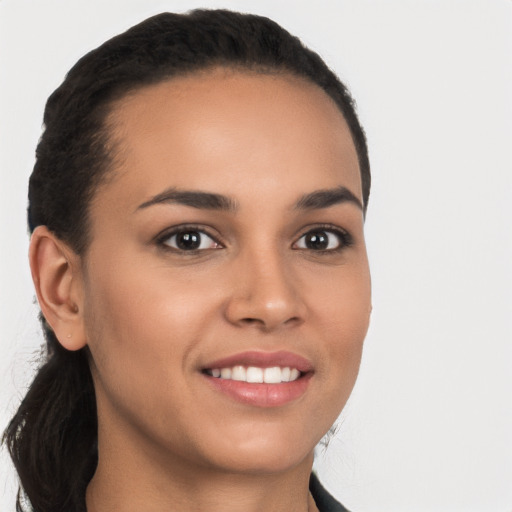 Joyful latino young-adult female with long  brown hair and brown eyes